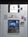An ATM machine associated with the Bank of China (Hong Kong) featuring logos of various payment networks such as UnionPay, Jetco, Visa, and Plus. Above the machine, a surveillance camera is visible. The design is predominantly white with blue and metallic elements.