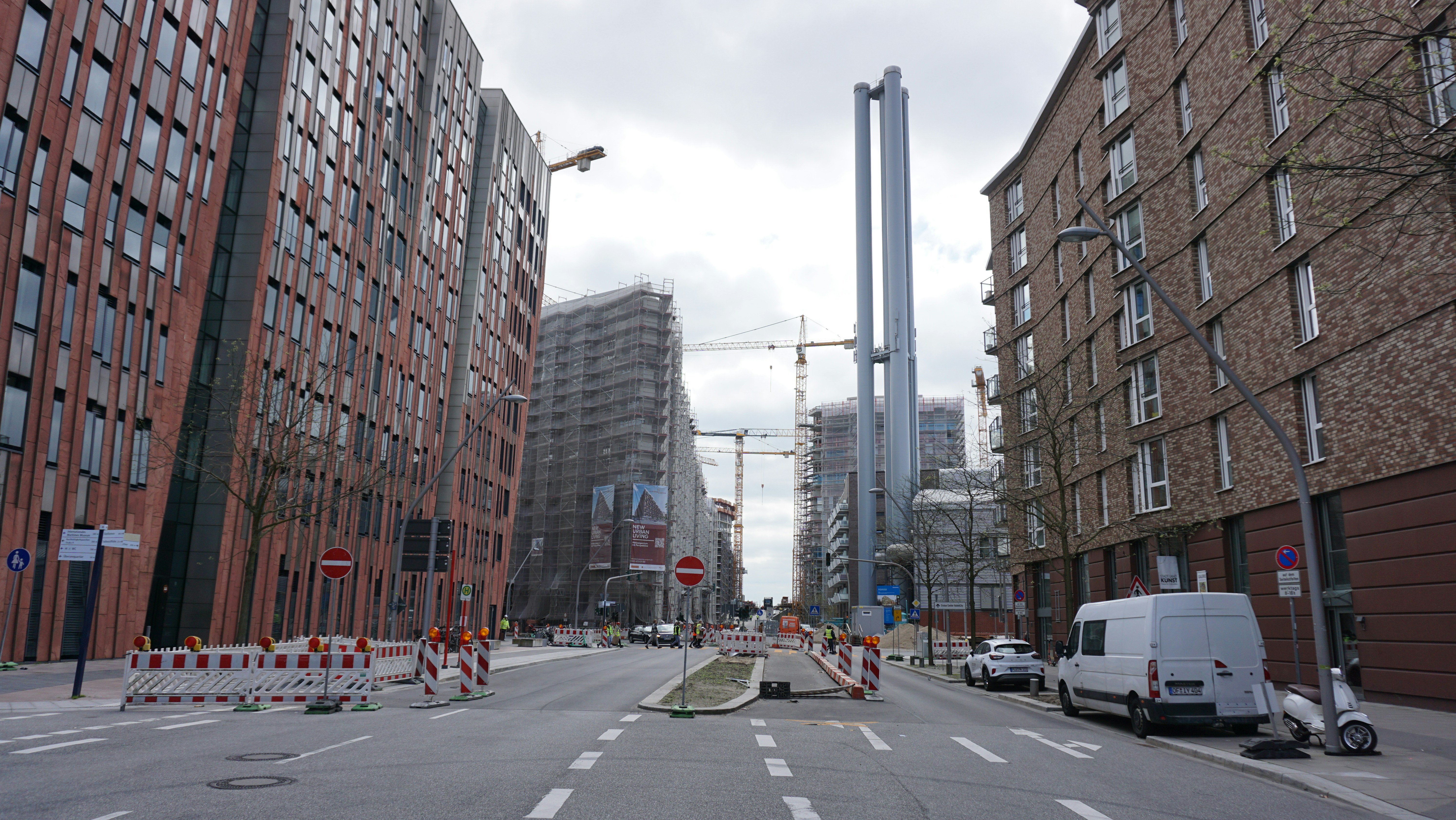 a city street with a construction site in the middle of it