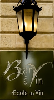 a street light mounted on the side of a building