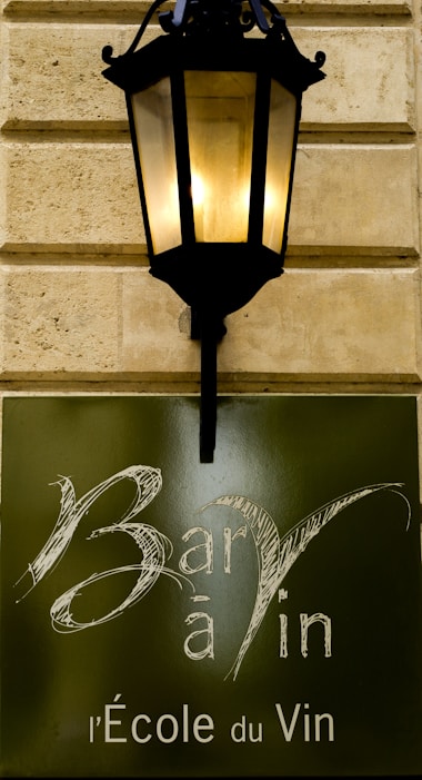 a street light mounted on the side of a building