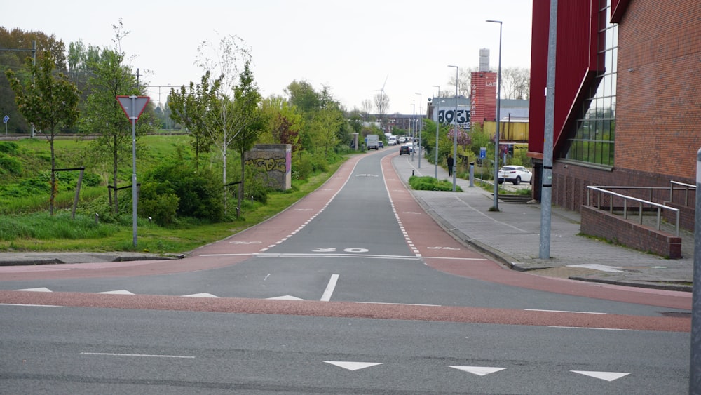 an empty street with a white arrow painted on it