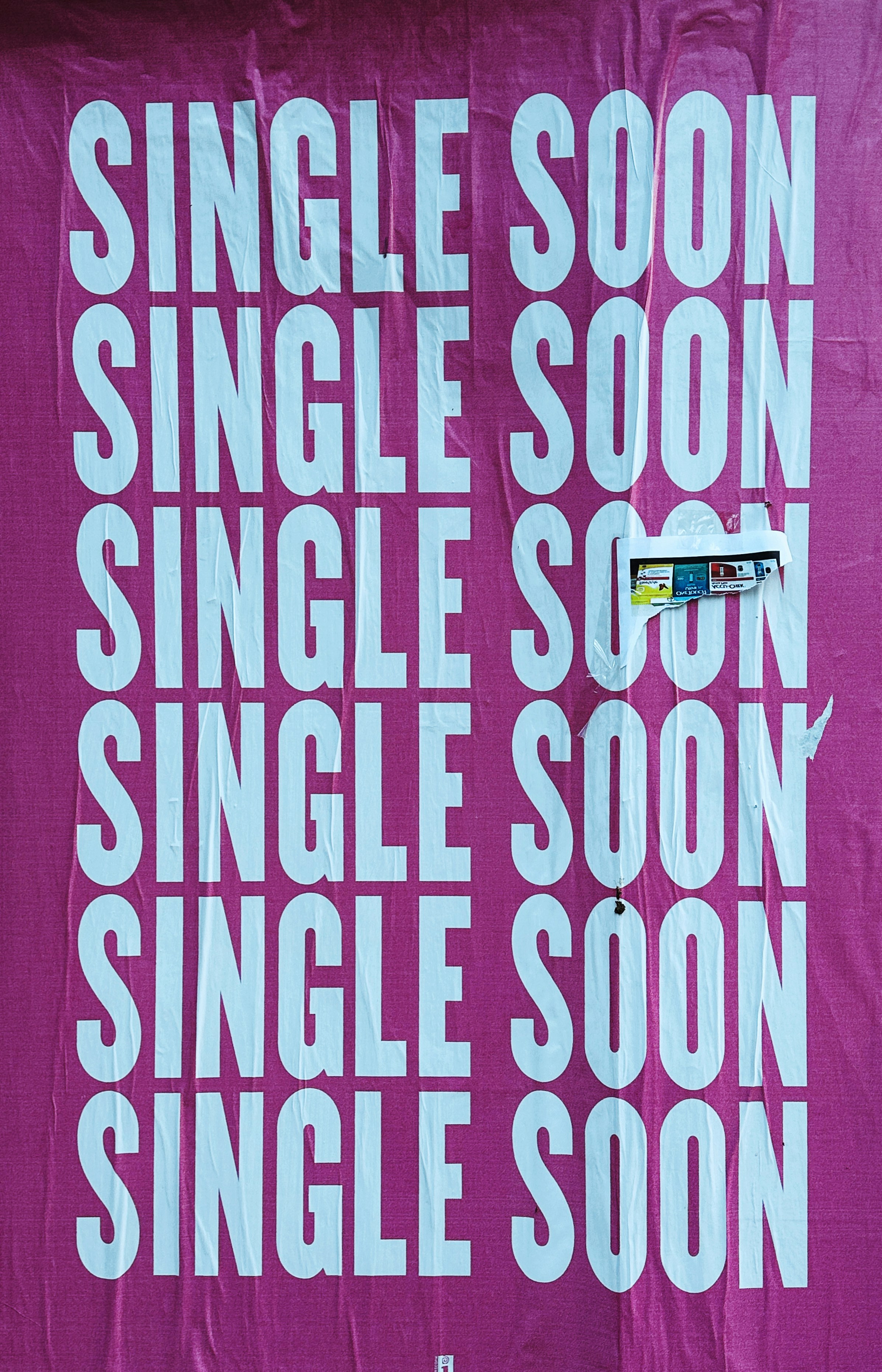 a pink poster with white writing on it