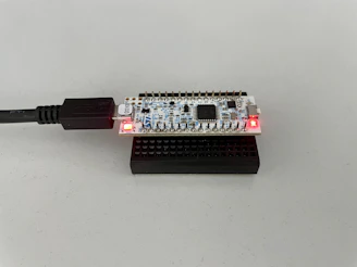Modern electronic controller unit with indicator lights and compact design
