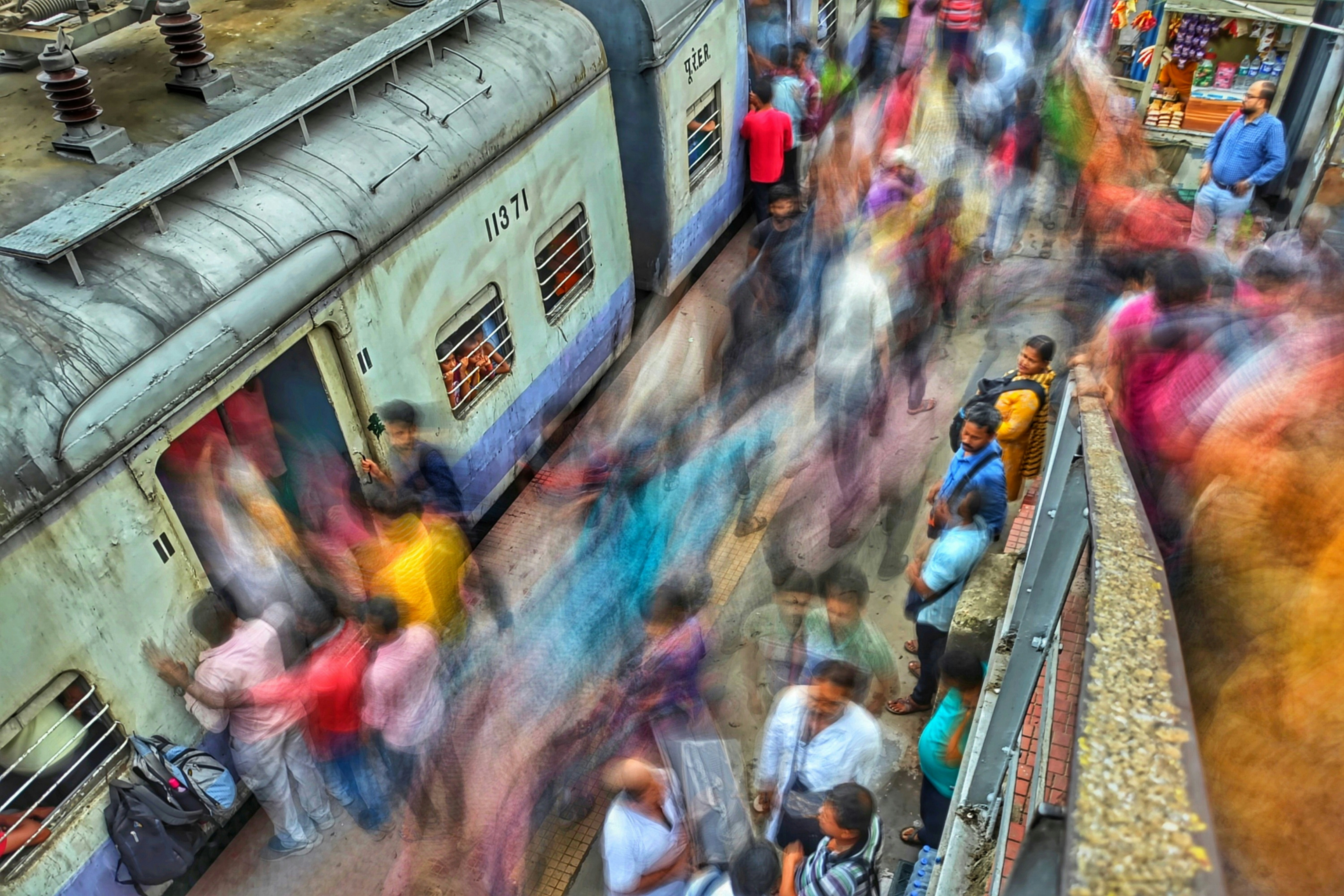 A modern, high-speed Indian train like Vande Bharat passing through a scenic route, symbolizing the journey from past to present.