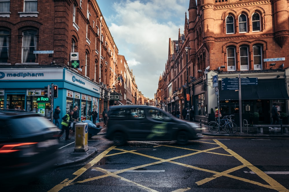 a busy city street with cars and pedestrians