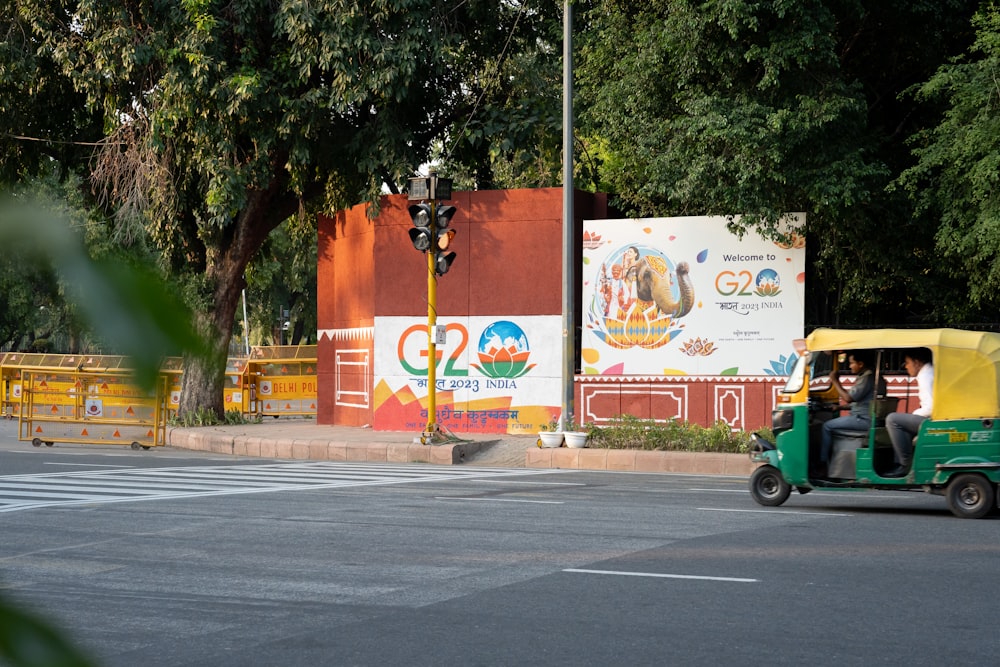 a man driving a cart down a street