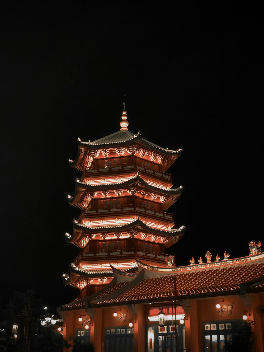 a tall tower lit up at night with lights