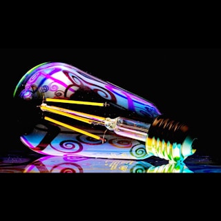 a colorful light bulb sitting on top of a table