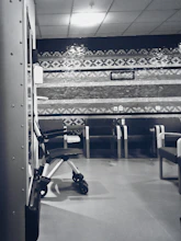 Friendly staff member assisting a patient with appointment scheduling at the front desk.