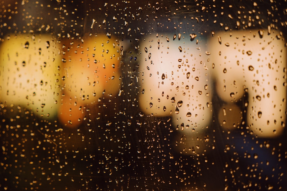 rain drops on a window with a blurry background