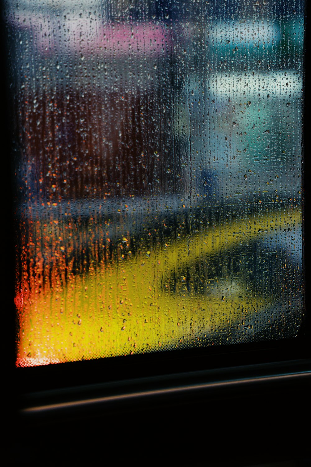 a close up of a window with rain on it
