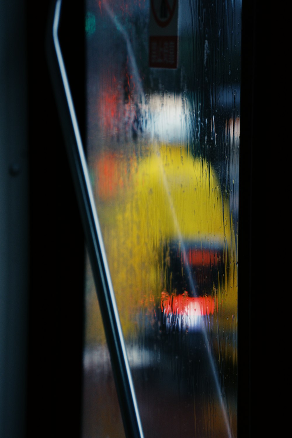 a view of a rainy street through a window