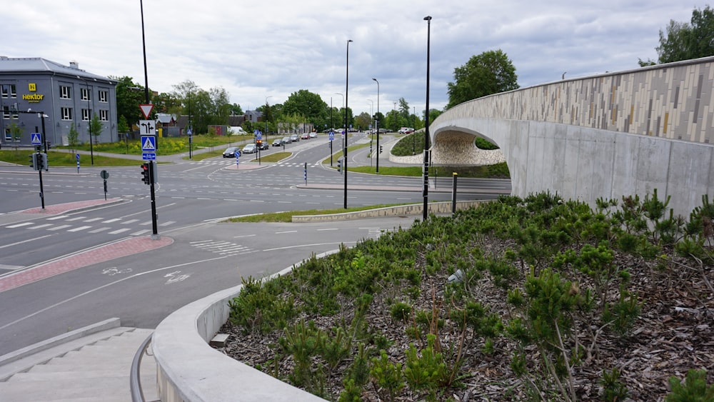 a city street with a bridge over it