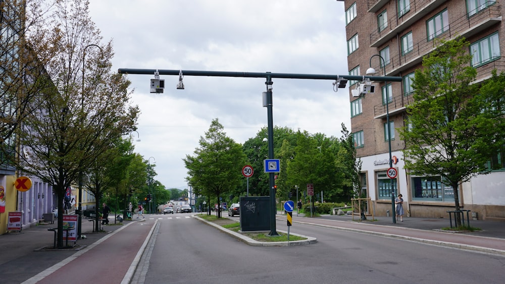 a street with a traffic light on the side of it