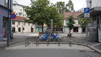 An aerial view of a busy urban area showcasing multiple bike parking locations.