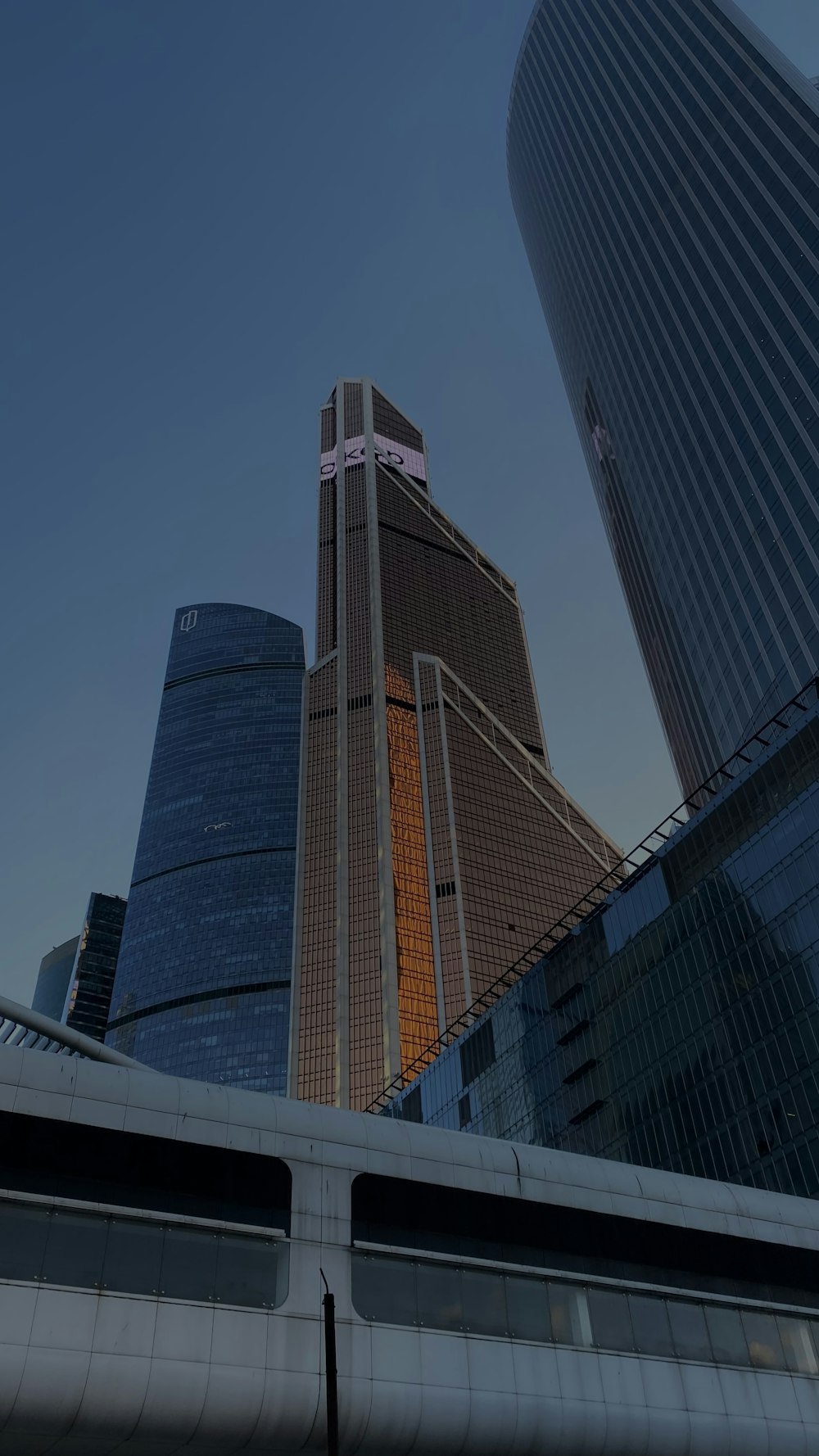 a train traveling past tall buildings in a city