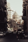 a city street filled with lots of tall buildings
