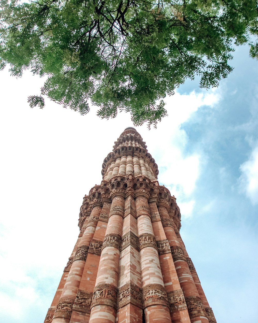 a tall tower with a clock on the top of it