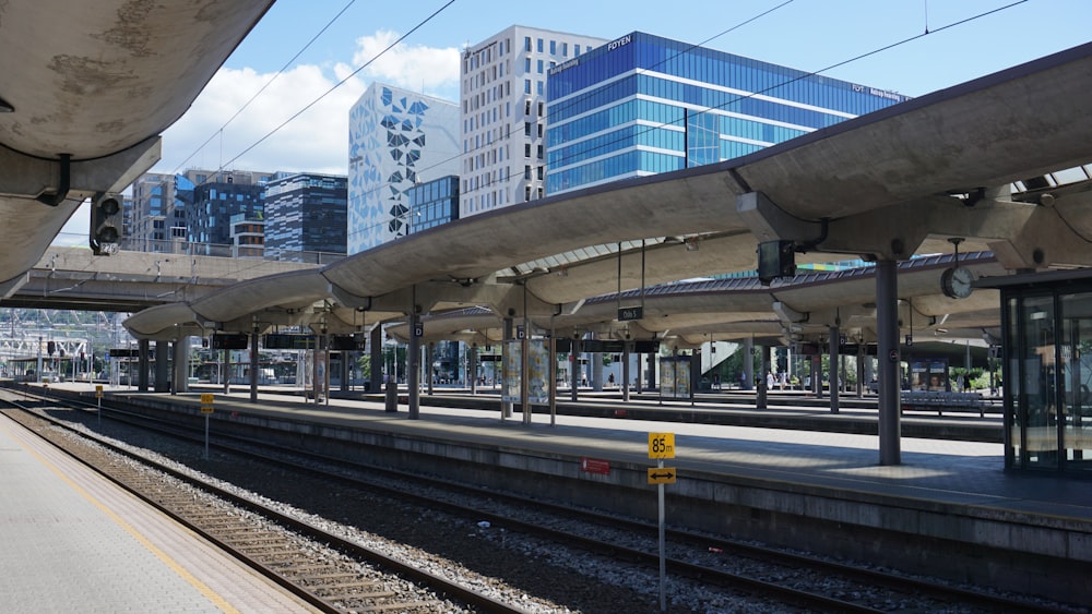 a train station with a train on the tracks