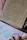 A warm close-up of a handwritten letter resting on textured cream paper with a gentle shadow.