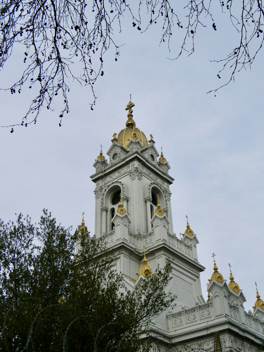 a large white building with a clock on it's side