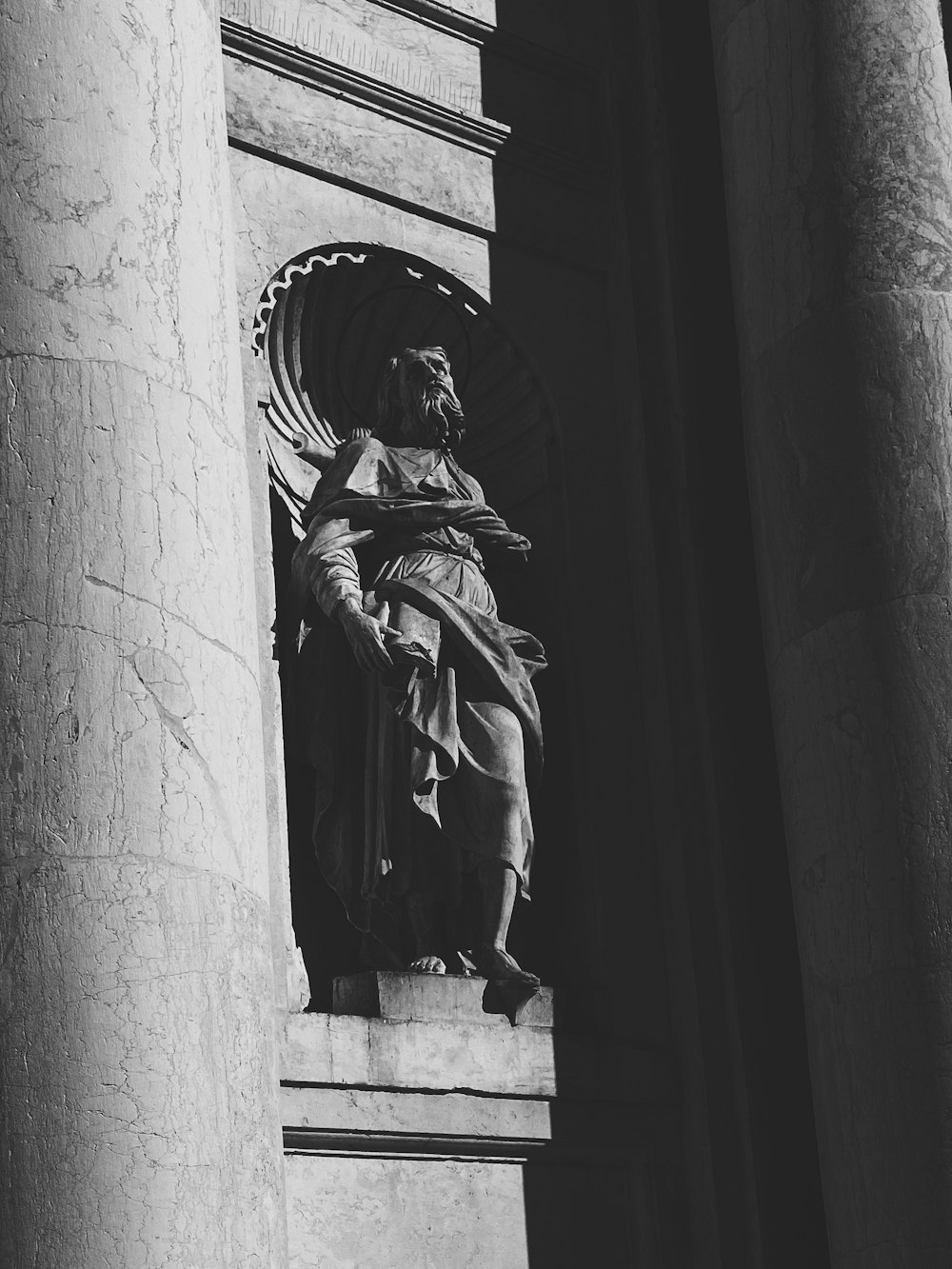 a black and white photo of a statue