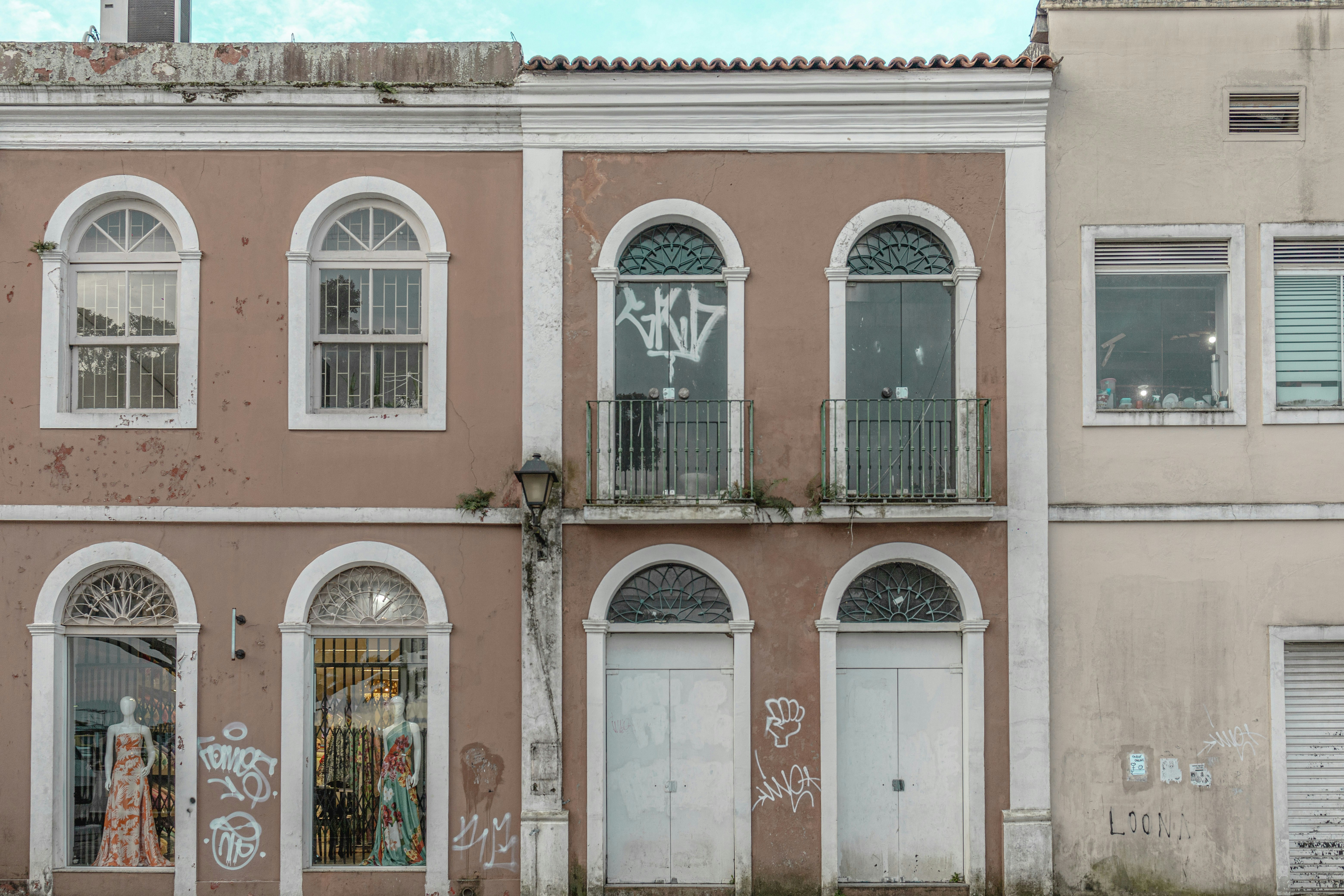 an old building with graffiti on the side of it