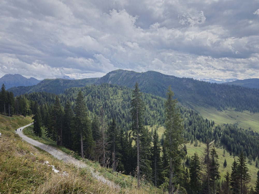 a scenic view of a mountain with a winding road