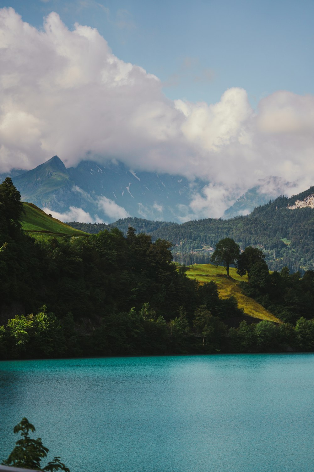 a body of water with mountains in the background