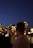 a man looking out over a city at night
