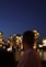 a man looking out over a city at night