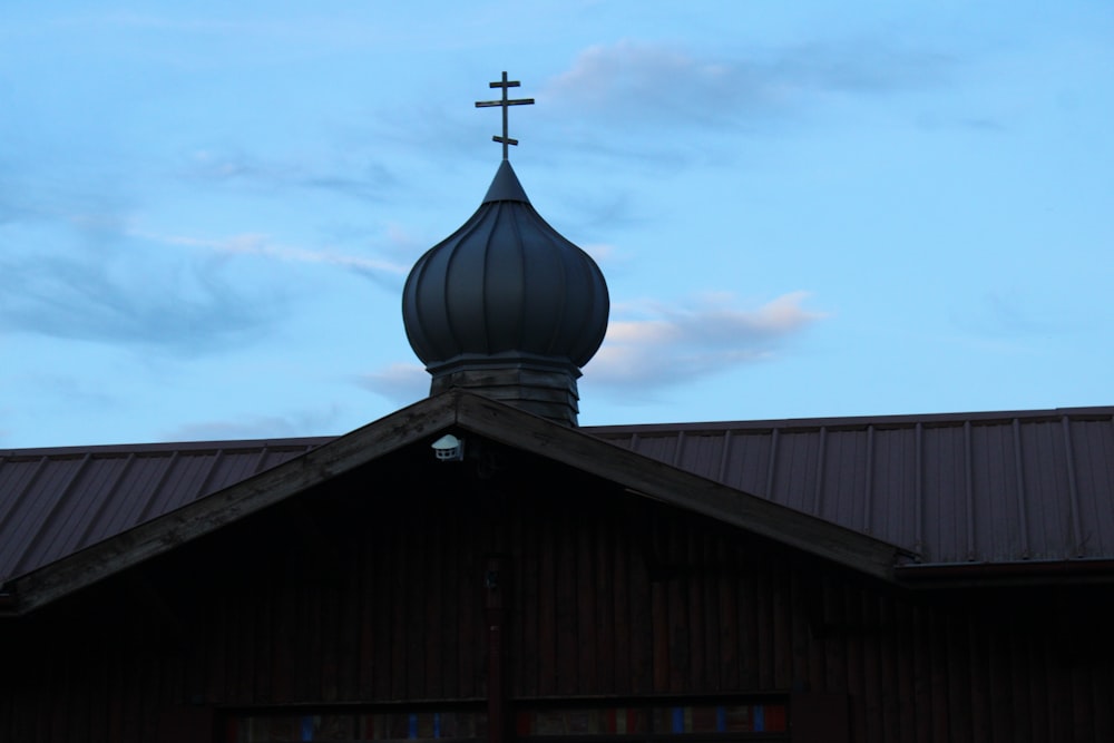 a church steeple with a cross on top