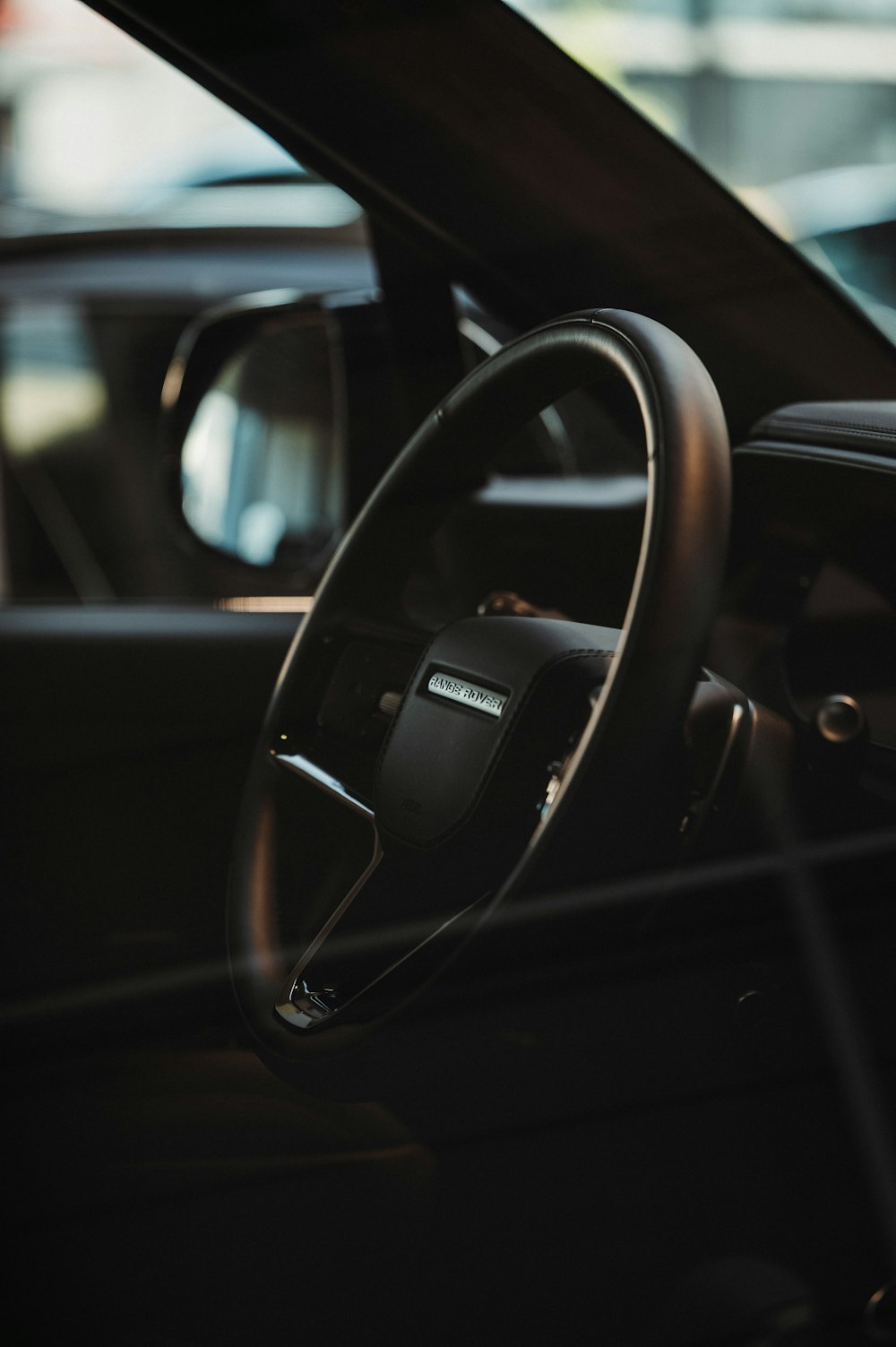 a close up of a steering wheel and dashboard of a car