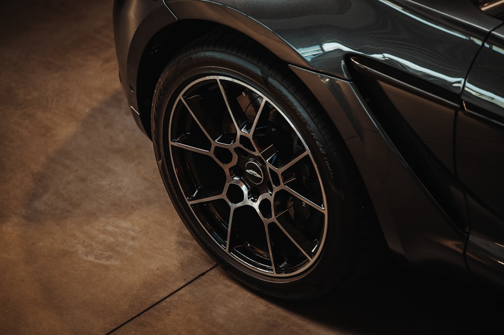 a black sports car parked in a garage