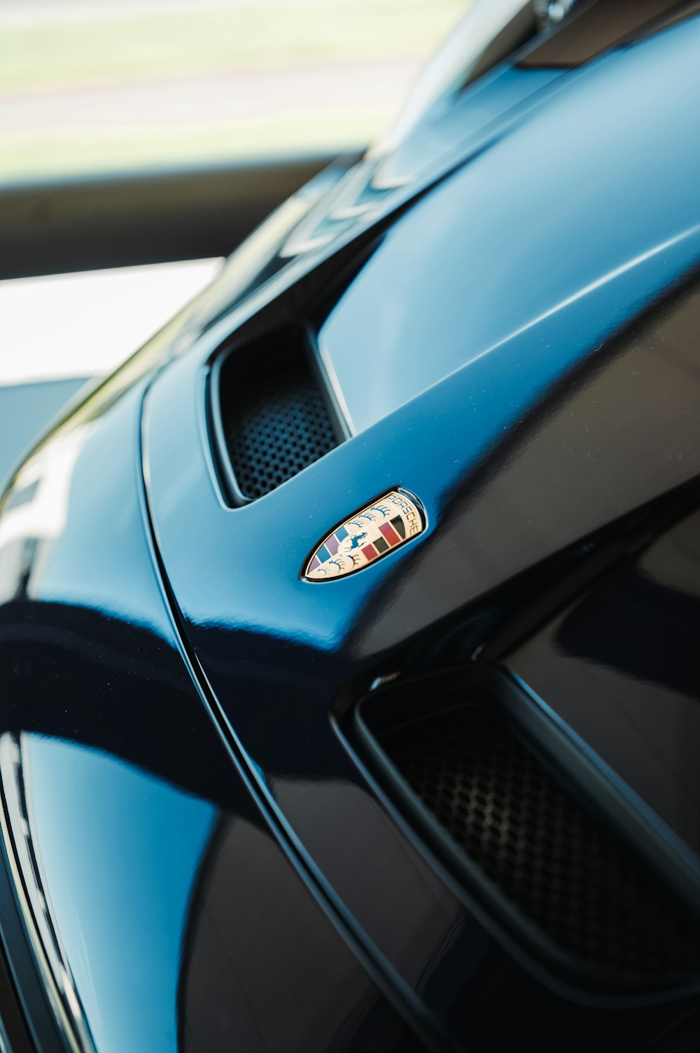 a close up of the hood of a sports car