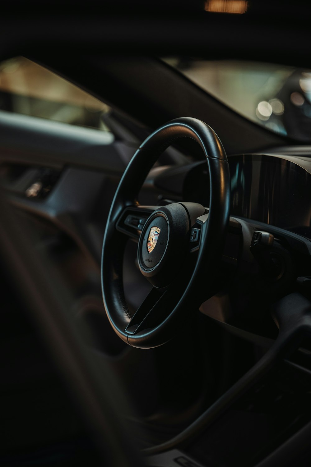 a close up of a steering wheel and dashboard of a car