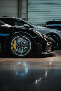 a black sports car parked in a garage