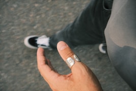 a person with a ring on their finger