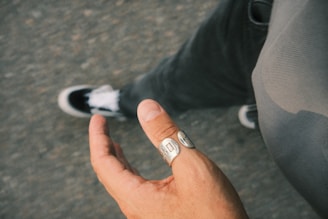 a person with a ring on their finger