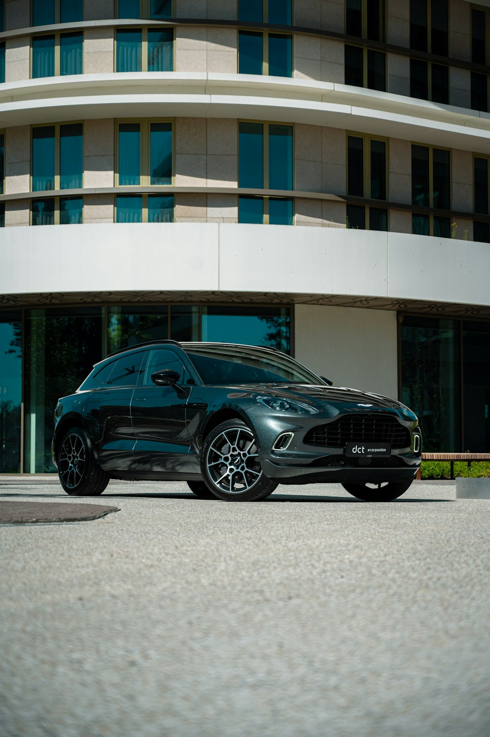 a black car parked in front of a building