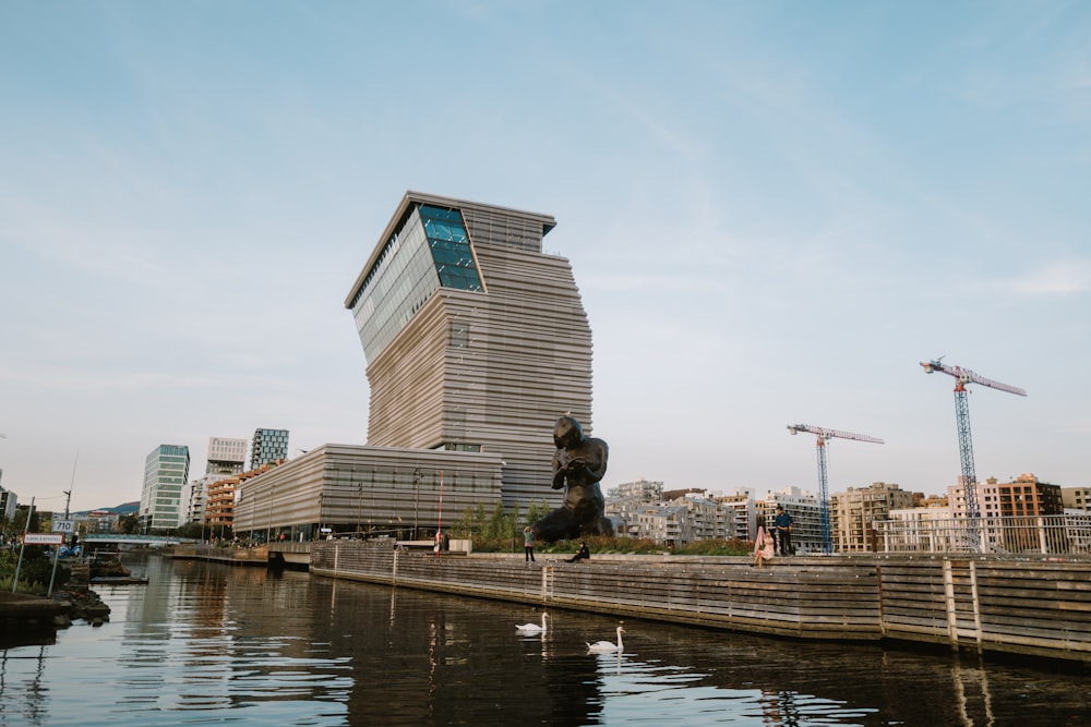 a body of water with a building in the background