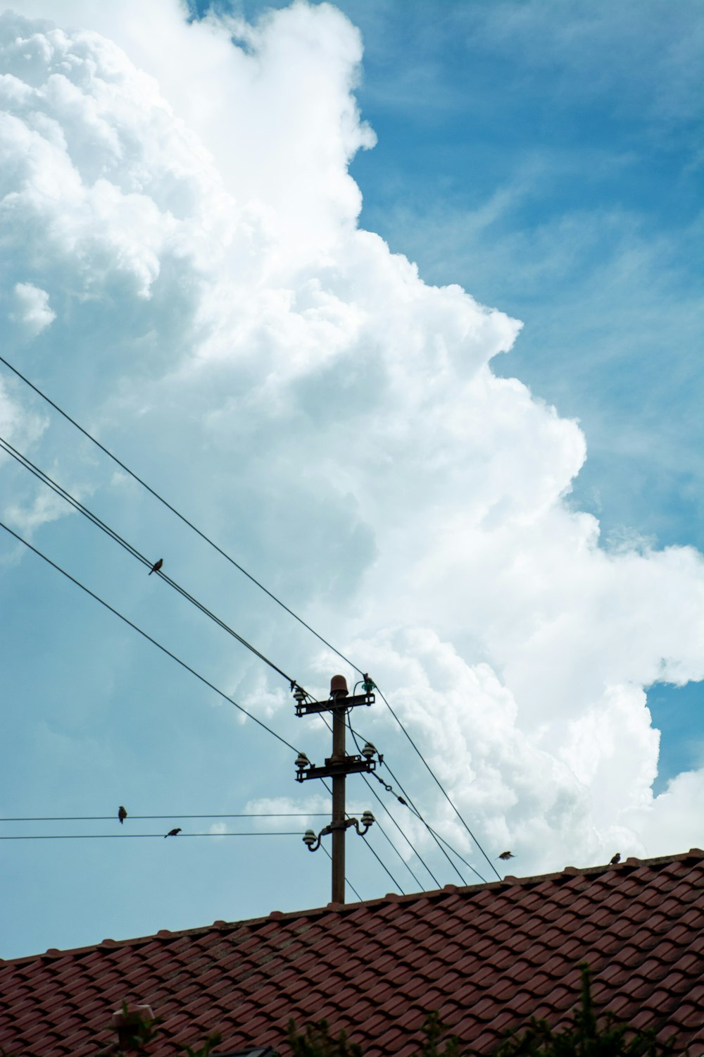 a view of a sky with clouds and power lines