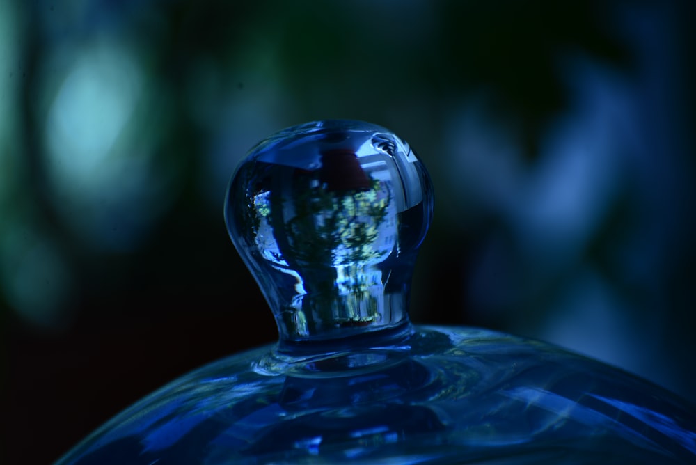 a close up of a blue glass bottle