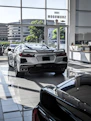 An inviting webpage featuring customer testimonials alongside car images and contact options.