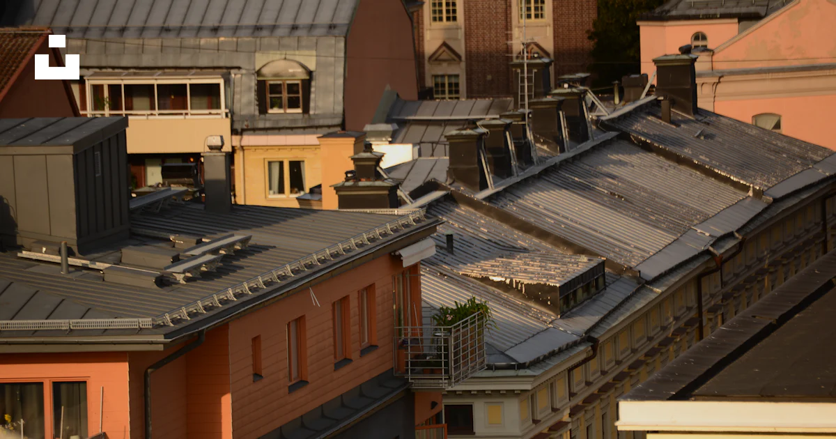Roguefort On Rooftops A view of a city with rooftops and buildings photo – Free Norrköping ...