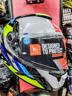 A customer inspecting a high-performance motorcycle helmet at Yankayak