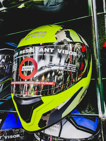 Vipers Fastpitch helmets displayed on a store shelf with price tags and product info.