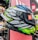 A satisfied rider showcasing their stylish helmet from motoluxe.online.