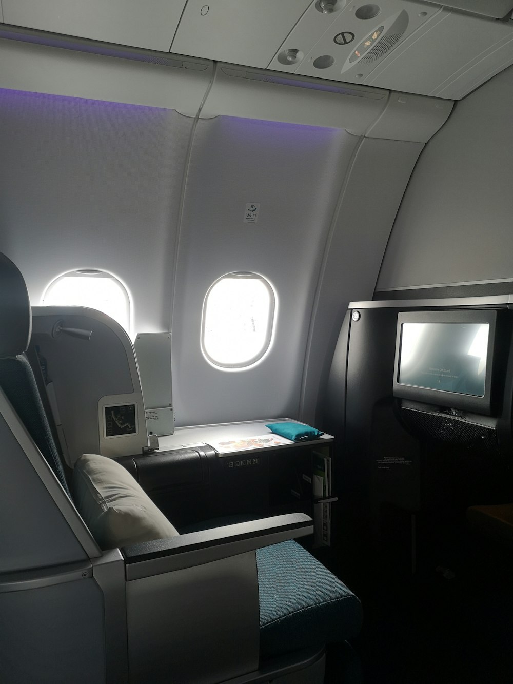 the inside of an airplane with a flat screen tv