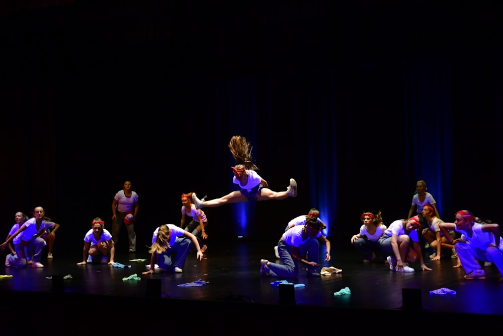 a group of people standing on top of a stage